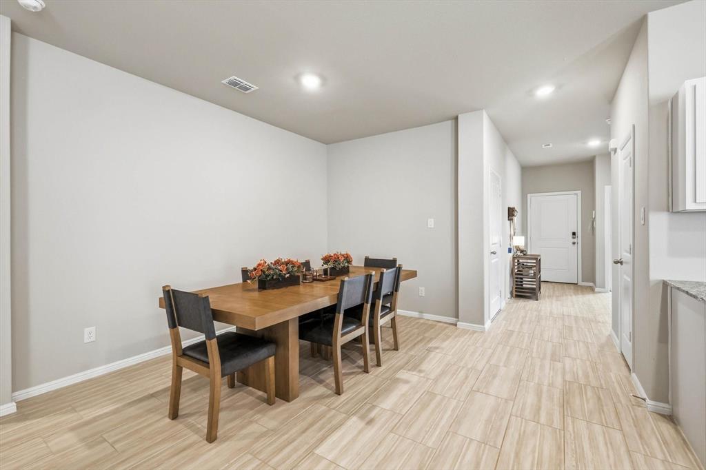 5344 Flannel Lane Krum, TX 76249 - Photo 11 of 40 a view of a dining room with furniture and wooden floor