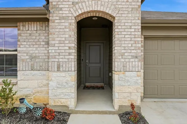 a front view of a house with a garage