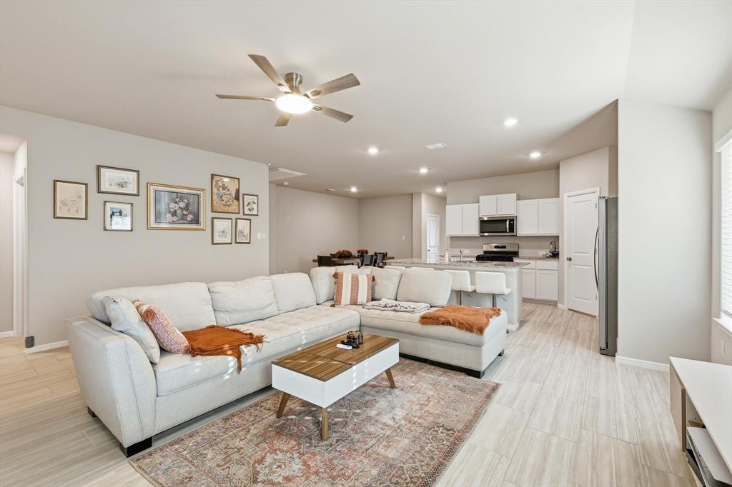 5344 Flannel Lane Krum, TX 76249 - Photo 21 of 40 a living room with furniture and kitchen view