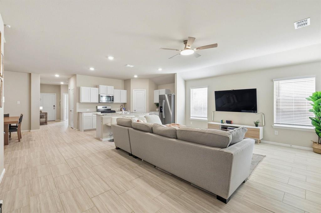 5344 Flannel Lane Krum, TX 76249 - Photo 24 of 40 a living room with furniture and a flat screen tv