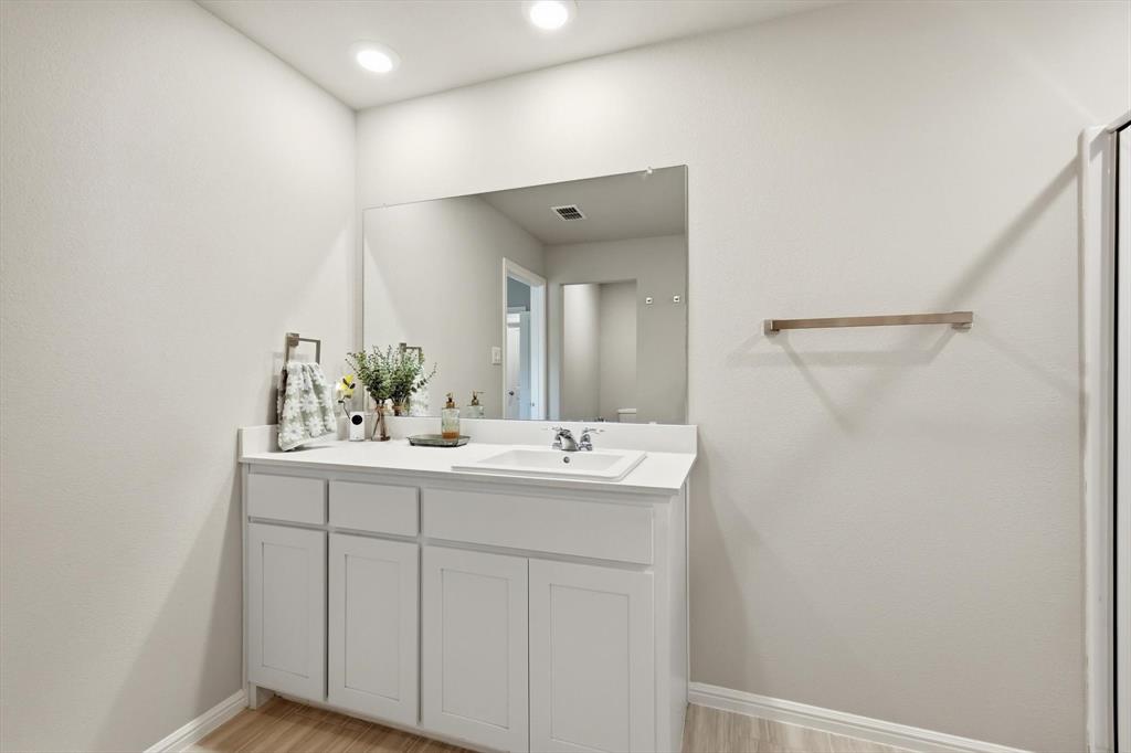 5344 Flannel Lane Krum, TX 76249 - Photo 29 of 40 a bathroom with a sink and a mirror