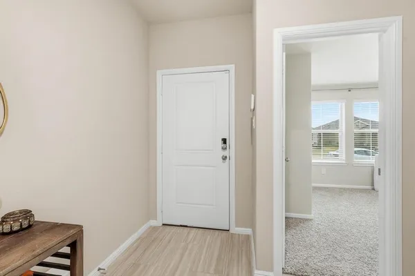 a view of room with window and wooden floor