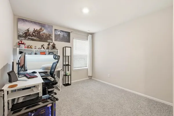 a view of workspace with wooden floor and gym equipment
