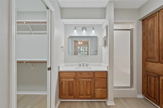 a bathroom with a granite countertop sink a mirror and a