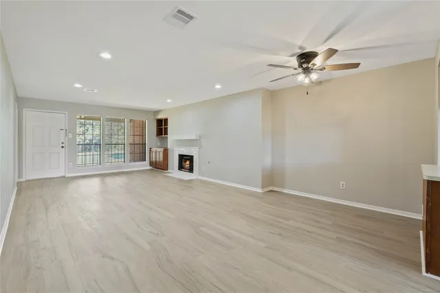 a view of an empty room with a window