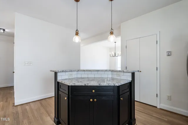 a room with cabinets and wooden floor