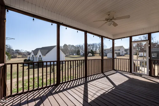 a view of a balcony with wooden floor