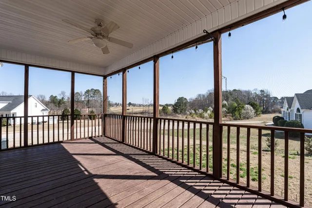 a view of a balcony with furniture