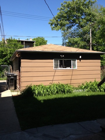 1842 South Drake Avenue Chicago, IL 60623 - Photo 13 of 25 a side view of a house with a yard