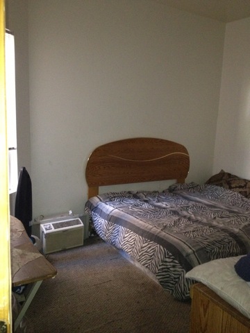 1842 South Drake Avenue Chicago, IL 60623 - Photo 19 of 25 a bedroom with a bed and a chair