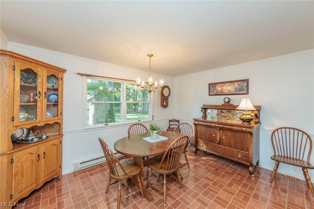 26585 Cook Road Olmsted Falls, OH 44138 - Photo 10 of 34 Large dining room with neutral decor and crown molding!