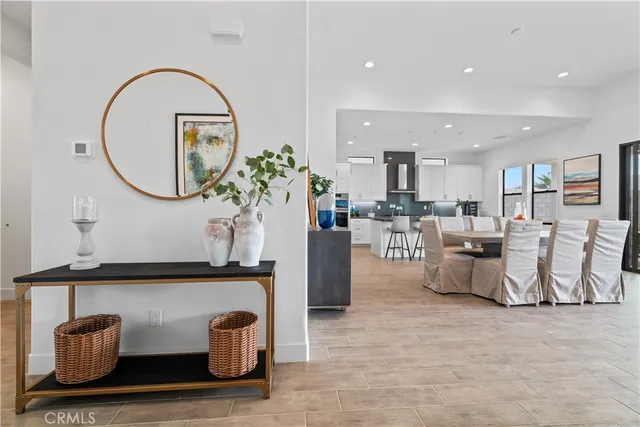 a living room with furniture and a mirror