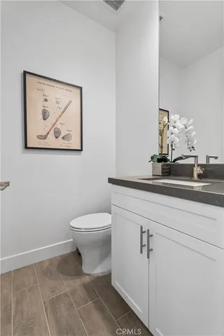 a bathroom with a toilet and a sink