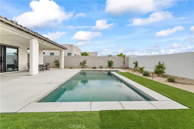 a view of a house with a swimming pool