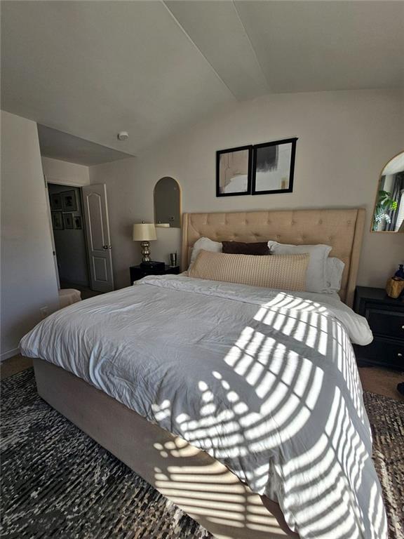 5747 Radford Loop Fairburn, GA 30213 - Photo 23 of 36 a bedroom with a bed and a chandelier
