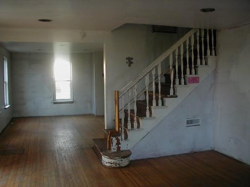 2451 North 18th Road Ransom, IL 60470 - Photo 8 of 13 a hallway with wooden floor windows and stairs