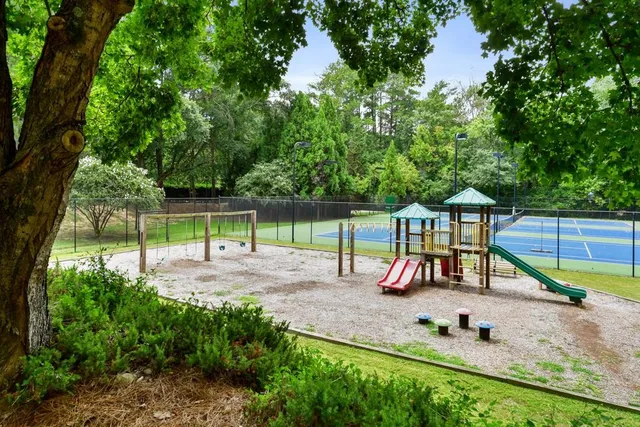 a view of park with sitting area and tub
