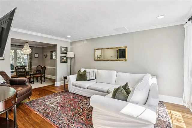 a living room with furniture and a rug