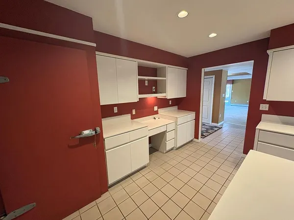 a bathroom with a sink a mirror and a toilet