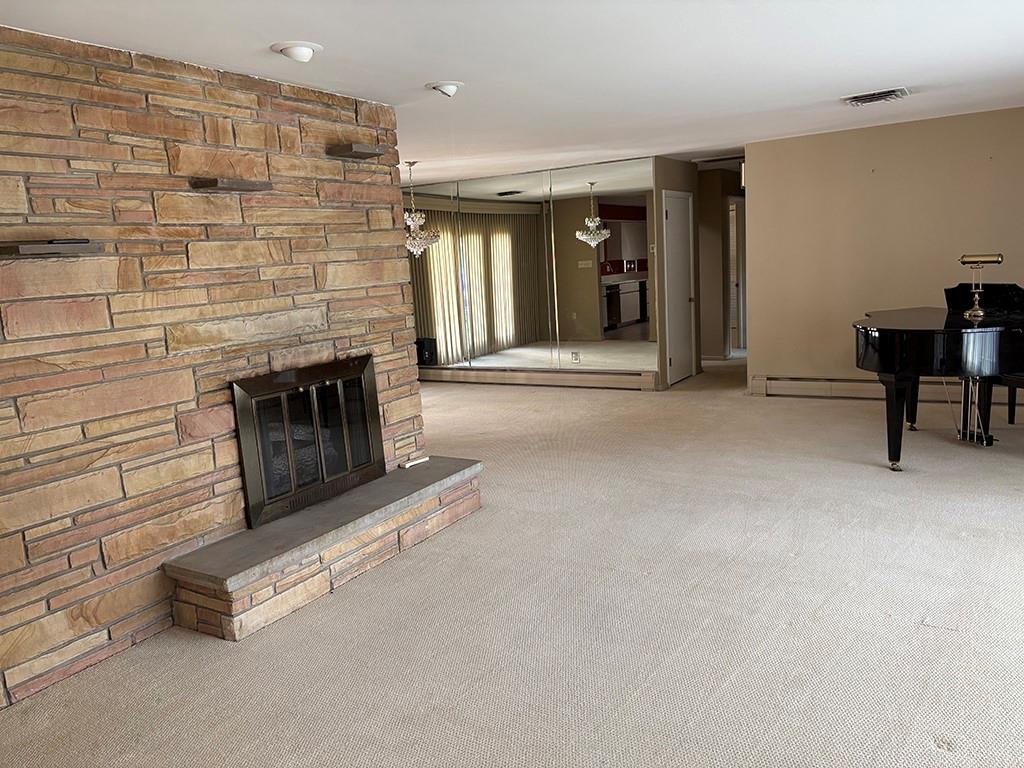 4400 West Pike Road Indiana, PA 15701 - Photo 19 of 37 an empty room with furniture and a fireplace