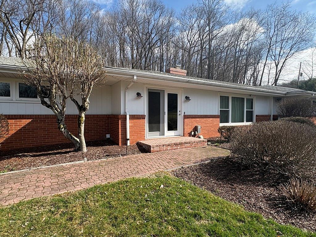 4400 West Pike Road Indiana, PA 15701 - Photo 22 of 37 a front view of house with yard and trees in the background