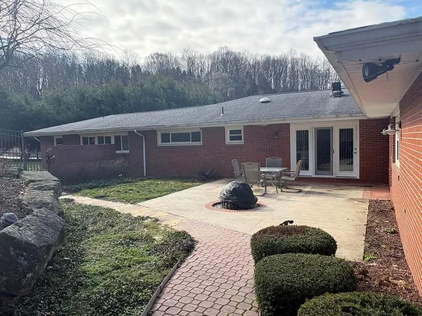 a view of backyard with green space