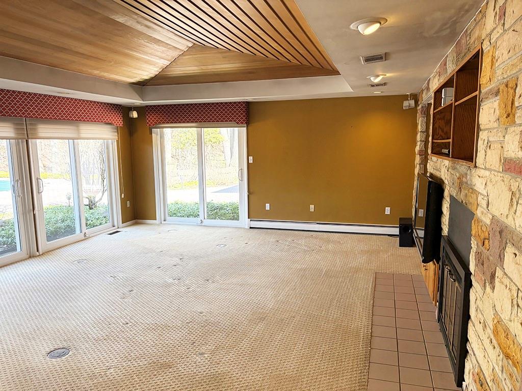4400 West Pike Road Indiana, PA 15701 - Photo 6 of 37 a view of an empty room with a fireplace and a window