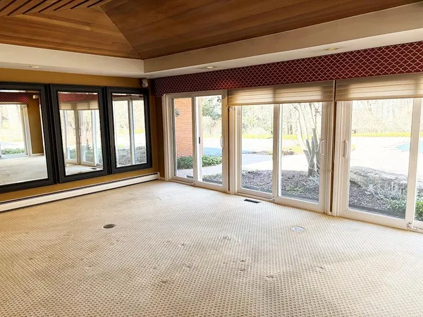 a view of an empty room with a balcony