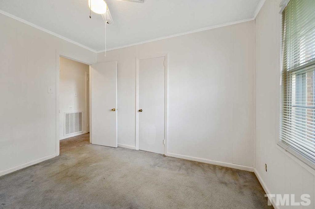 2930 Fairway Drive Raleigh, NC 27603 - Photo 11 of 24 an empty room with windows