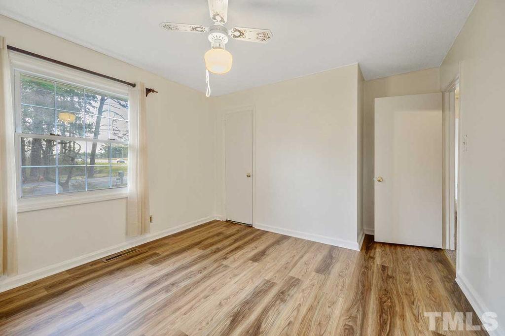2930 Fairway Drive Raleigh, NC 27603 - Photo 14 of 24 a view of a room with wooden floor and white walls