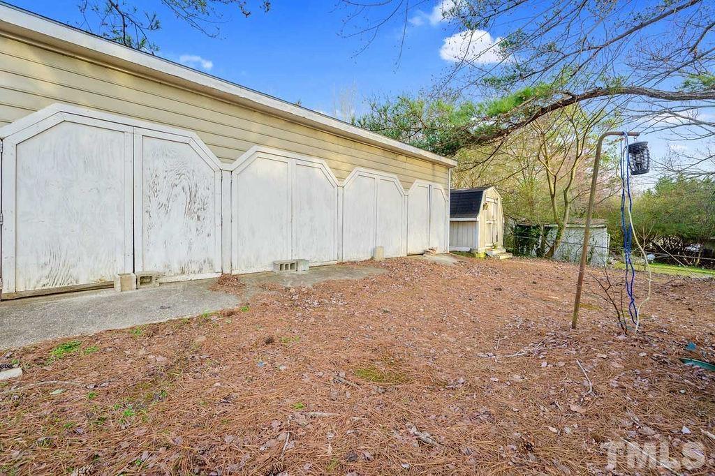 2930 Fairway Drive Raleigh, NC 27603 - Photo 22 of 24 a backyard of a house