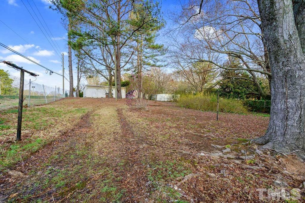 2930 Fairway Drive Raleigh, NC 27603 - Photo 23 of 24 a view of a yard with a tree