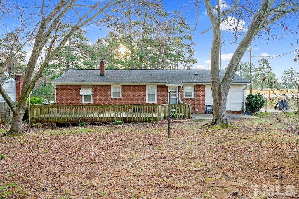 2930 Fairway Drive Raleigh, NC 27603 - Photo 24 of 24 a house with a tree in the background