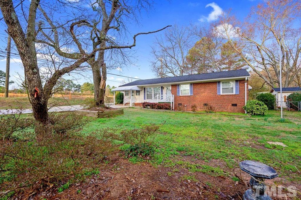 2930 Fairway Drive Raleigh, NC 27603 - Photo 3 of 24 a front view of a house with garden