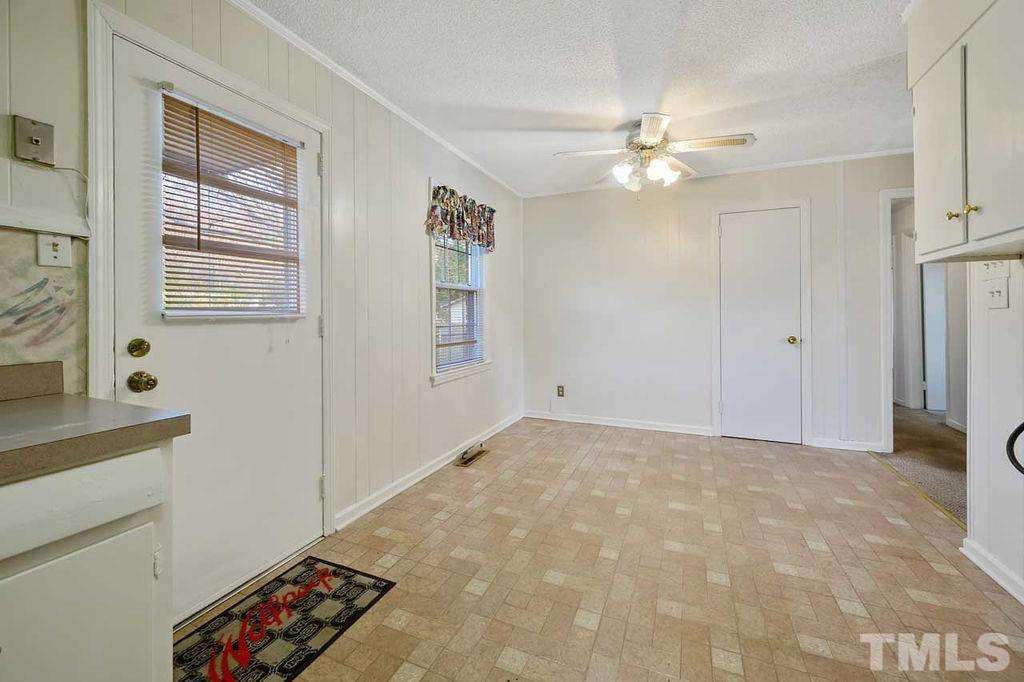 2930 Fairway Drive Raleigh, NC 27603 - Photo 10 of 24 a view of a livingroom with a ceiling fan and window