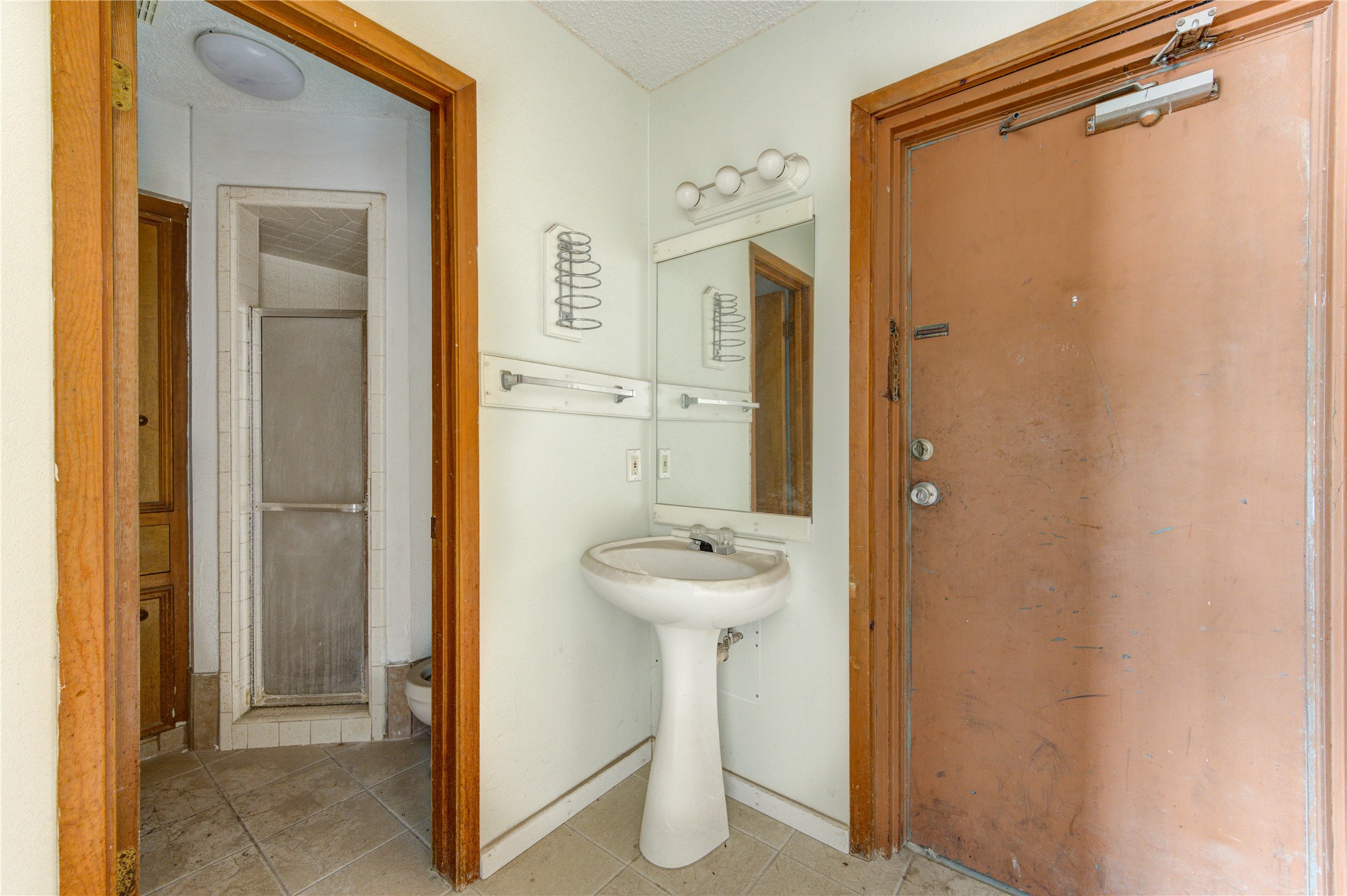4602 Avenue H Rosenberg, TX 77471 - Photo 11 of 42 a bathroom with a sink a toilet and shower