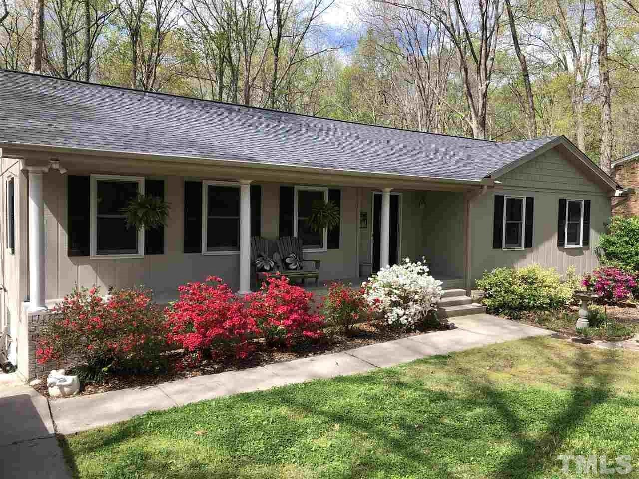 4909 Oak Park Road Raleigh, NC 27612 - Photo 2 of 11 Just look at those azaleas! Looking on to the backyard from the deck makes it feel private! There is also a wonderful wooded "central park" close to this home, leading to the pool. Memberships for sale now!