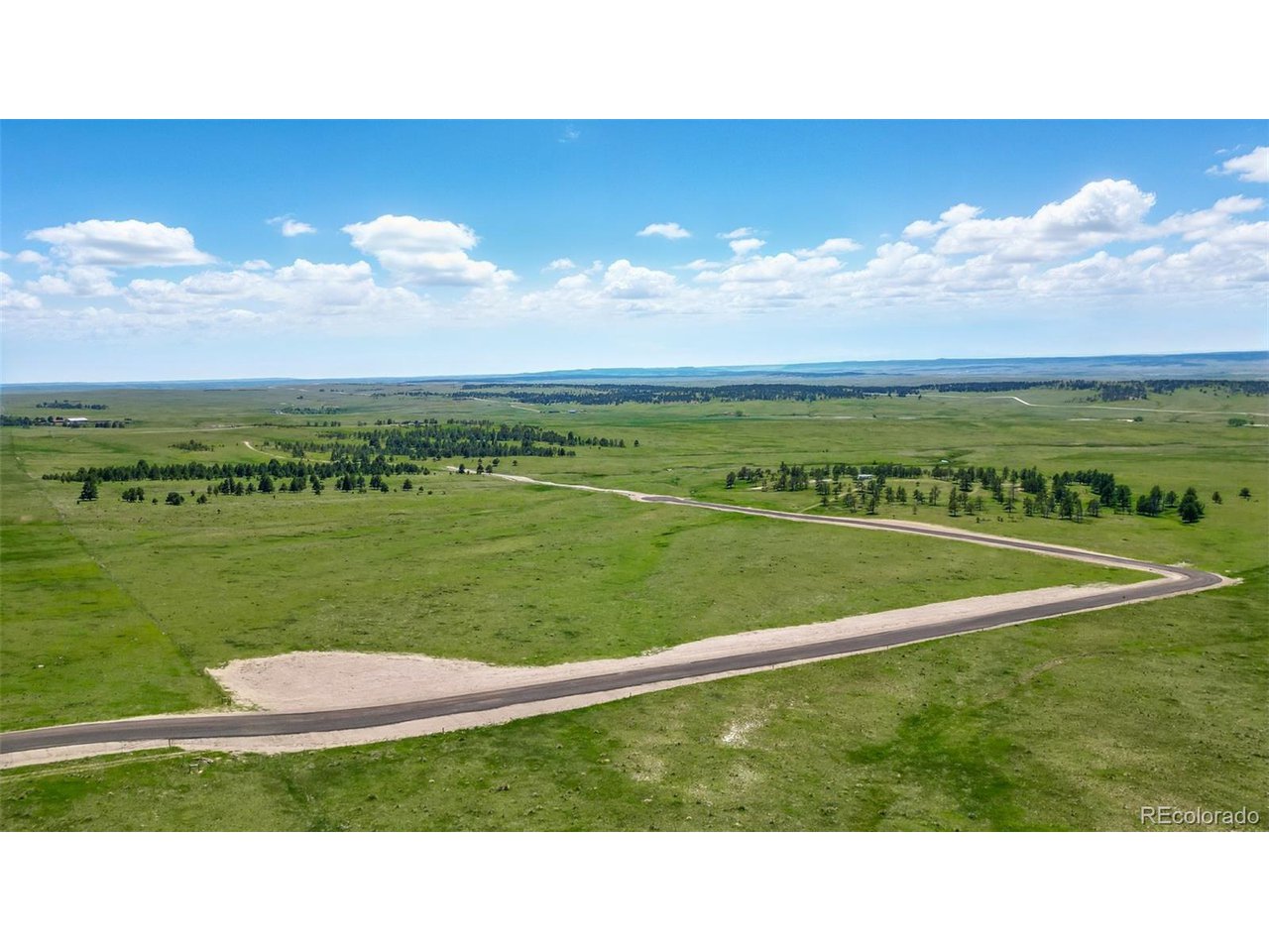 12 Paz Street Ramah, CO 80832 - Photo 9 of 11 a view of a golf course with a lake
