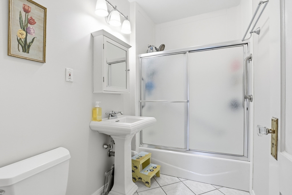 80 Concord Street Maynard, MA 01754 - Photo 15 of 29 a bathroom with a sink toilet and shower