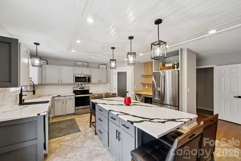 a kitchen that has a lot of cabinets in it