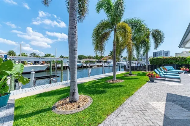 a view of swimming pool with sitting area and slide