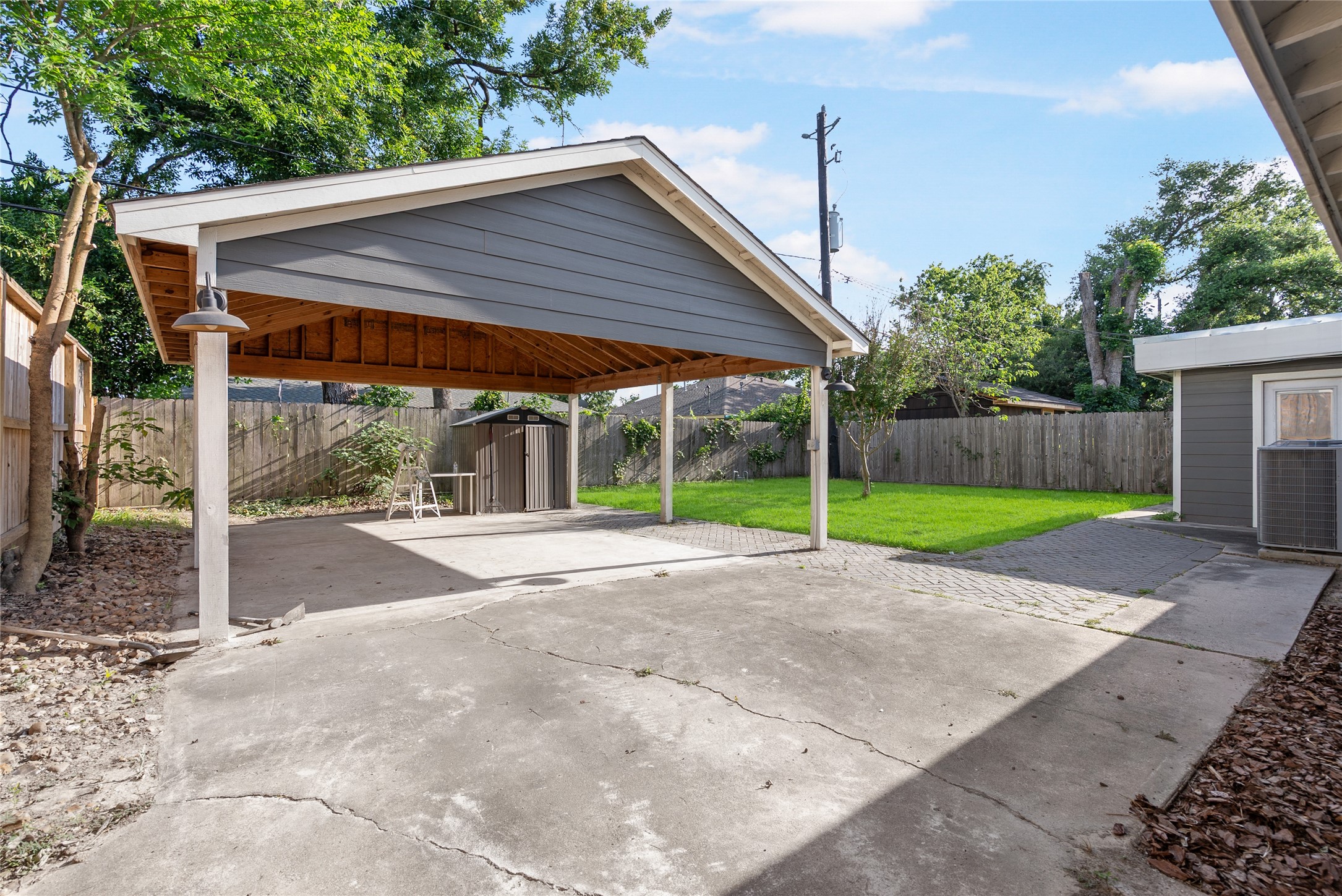 7307 Raton Street Houston, TX 77055 - Photo 22 of 23 This extended patio space is low maintenance, while you enjoy fun outdoor activities!