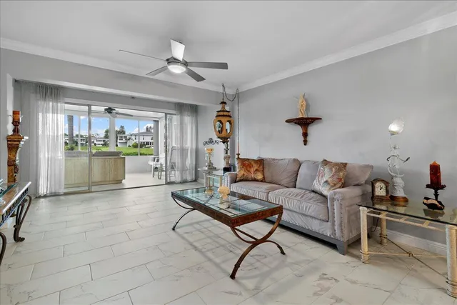 a living room with furniture and a kitchen