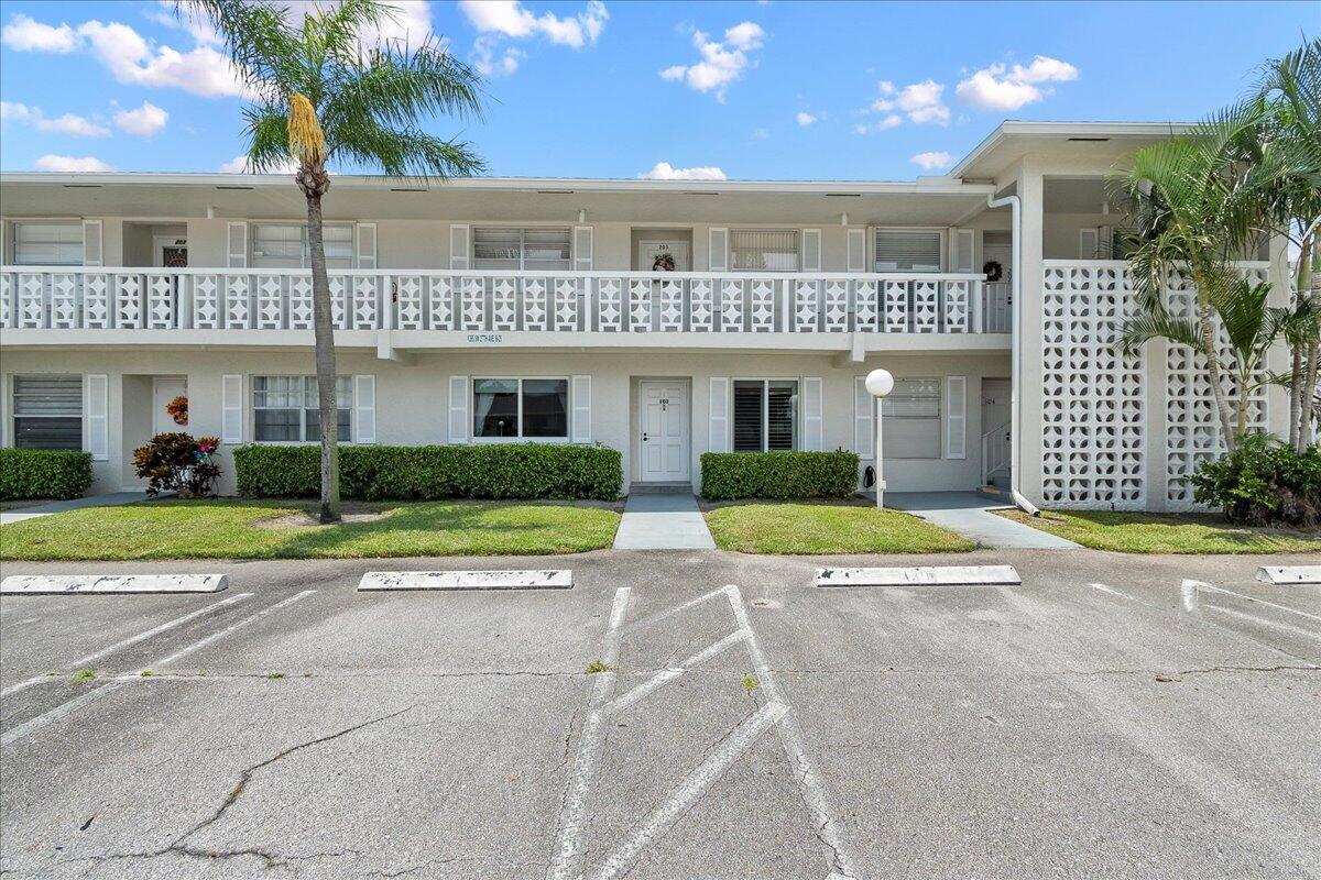1395 Southwest 27th Avenue, Unit 103 Delray Beach, FL 33445 - Photo 2 of 26 a view of a house with a patio