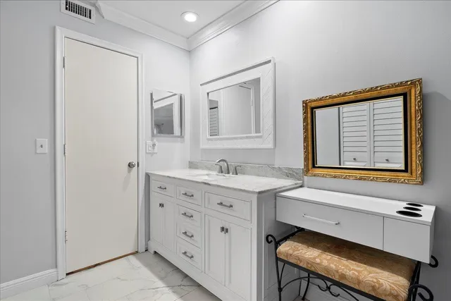 a bathroom with a sink a mirror and a toilet