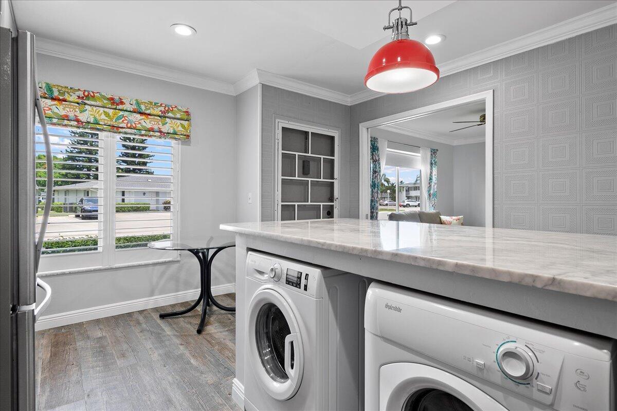 1395 Southwest 27th Avenue, Unit 103 Delray Beach, FL 33445 - Photo 8 of 26 a view of livingroom with washer and dryer