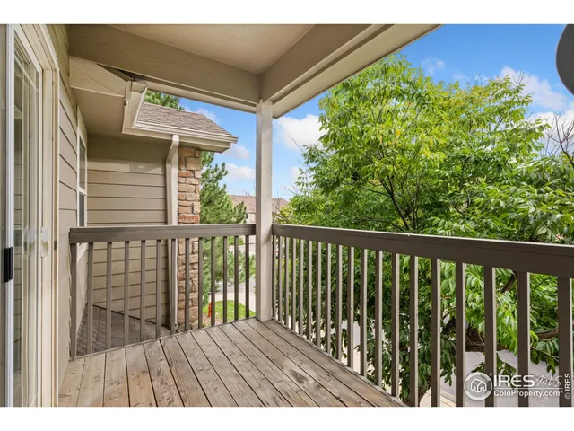 a view of balcony with wooden floor