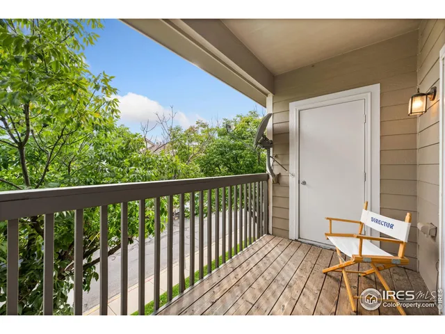 a view of balcony with wooden floor