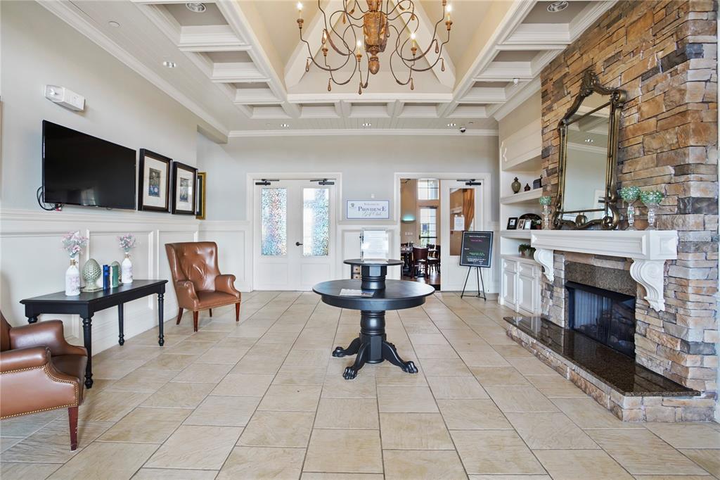 4111 Eastminster Road Davenport, FL 33837 - Photo 15 of 18 a living room with furniture a flat screen tv and a fireplace