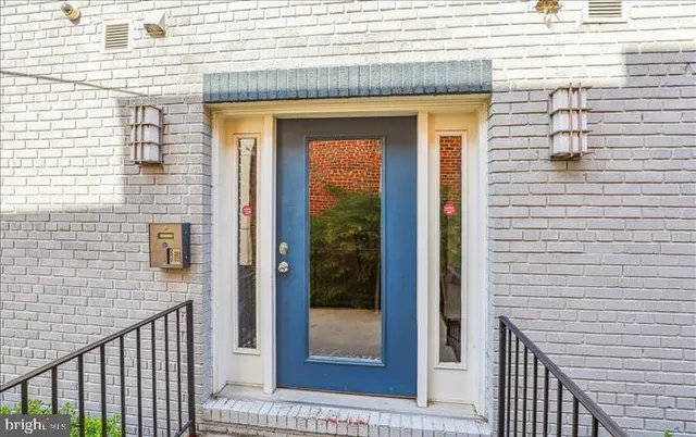 a view of a brick house with a door